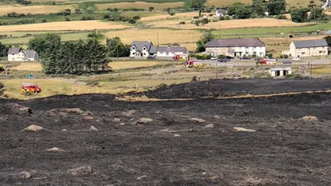 North Wales Fire and Rescue Service Scorched earth following a fire at Carmel