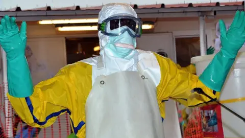 AFP An Ebola worker in Guinea - archive