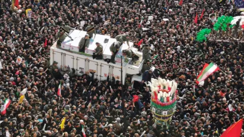 Getty Images Mourners gather to pay homage to top Iranian military commander Qasem Soleimani