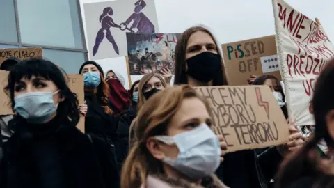 Bartosz Banka/Agencja Gazeta/Reuters Demonstrators, including students and employees of a local university, hold a protest against the ruling by Poland's Constitutional Tribunal that imposes a near-total ban on abortion, in Gdansk