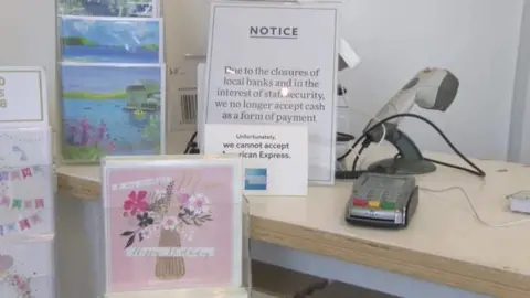 Notice, card payment machine and selection of greetings cards