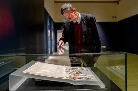 PA Media Dr Alan Borthwick at the Declaration of Arbroath display