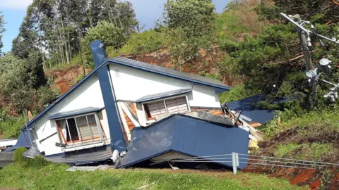 EPA/Jiji press Damaged house in Atsuma town