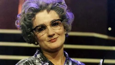 PA Media Caroline Aherne as Mrs Merton