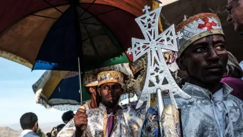 Getty Images On Monday Ethiopian Orthodox pilgrims rest as they attend their Christmas Eve celebration at the Saint Mary's Church in Lalibela, Ethiopia - Monday 7 January 2019