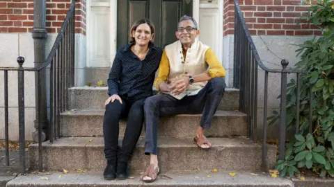 AFP Abhijit Banerjee and Esther Duflo winners of the 2019 Nobel Prize for Economics at their home in Boston, Massachusetts on October 14, 2019.