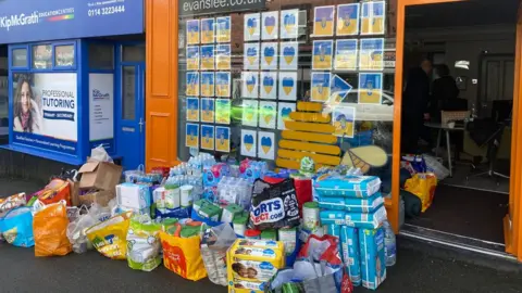 Evans Lee The donations outside the shop