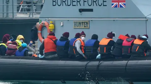  A group of people thought to be migrants are brought in to Dover