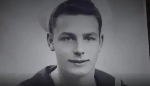 John Dennett John Dennett in his Royal Navy uniform