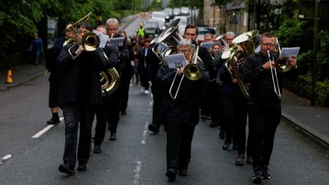 A brass band performs during a Whit Friday contest