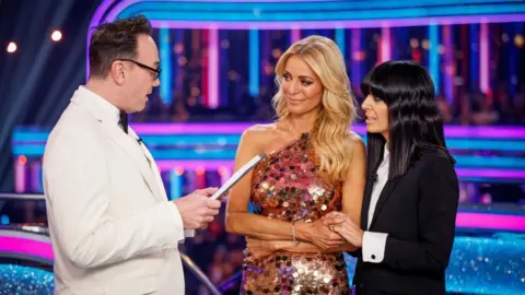 Craig Revel Horwood with Tess Daly and Claudia Winkleman, during Strictly Come Dancing 2025. 