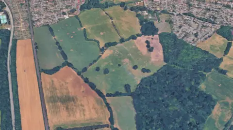 A satellite photo of fields near Romsey divided by streams and hedgerows.