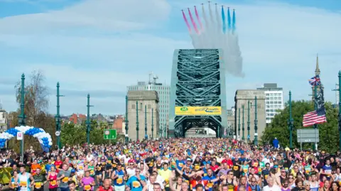 PA Media The Red Arrows are seen flying over the Tyne Bridge during the 2015 Morrisons Great North Run, Newcastle.