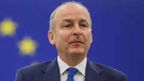 EPA A man with grey hair and navy top and white shirt