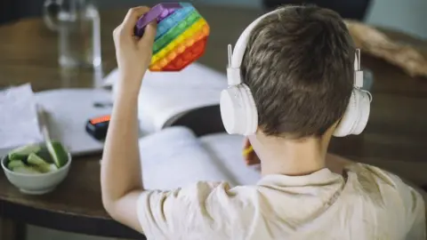 Getty Images Boy doing puzzles