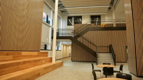 City of Wolverhampton Council The inside of the college has wooden panelling throughout with open areas and stairs leading to upper levels.