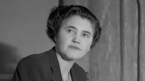 A black and white photo taken in 1948 of Jennie Lee, then Labour MP for Cannock, in her London office.