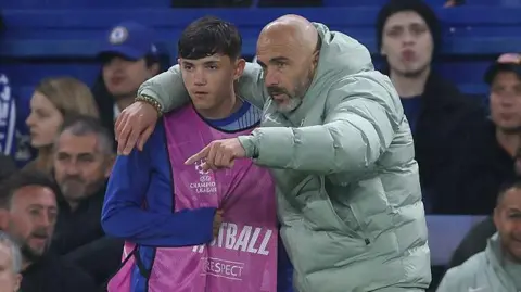 Walsh being briefed by Maresca before coming on against Ajax