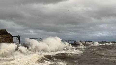 Lawrence/BBC Weather Watchers Big waves at the railway line at Saltcoats in North Ayrshire.