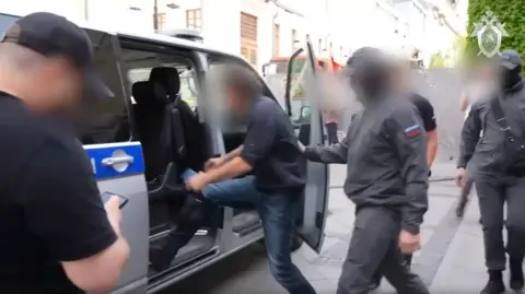 Screen shot from footage purportedly showing the arrest of the French suspect in Moscow, Russia