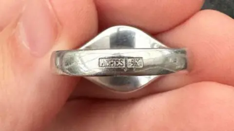 Max Cockrell Ring showing engraving saying "ashes"