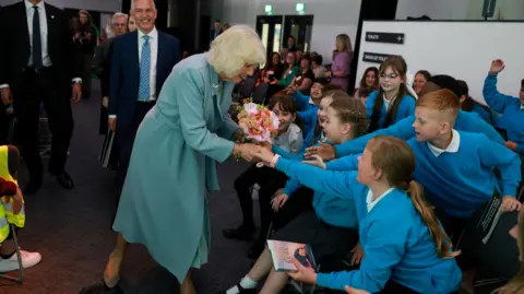 REUTERS/Phil Noble/Pool Britain's Queen Camilla meet with school children, during her visit to celebrate the city's year as UK City of Culture, in Bradford