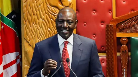 President William Ruto speaking into a microphone during his state of the nation address on 21 November 2024.