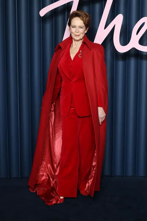 Getty Celia Imrie in a red velvet suit and cape