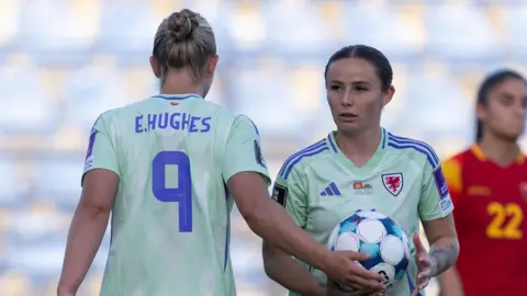 Elise Hughes and Hannah Cain during Wales' draw in Montenegro