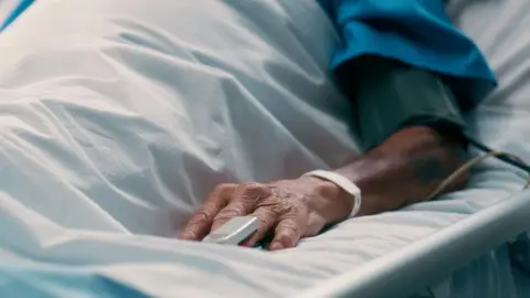 Elderly man, hand and recovery on bed hospital for pulse monitor, healthcare treatment and healing from surgery. Senior, male patient and sleep, emergency icu and chronic disease for wellness - stock photo
Elderly man, hand and recovery on bed hospital for pulse monitor, healthcare treatment and healing from surgery. Senior, male patient and sleep, emergency icu and chronic disease for wellness