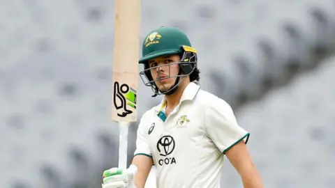 Sam Konstas raises his bat while playing for Australia A against India A in November