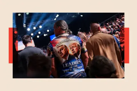 Reuters A man wears a shirt supporting U.S. President Donald Trump and Hungarian Prime Minister Viktor Orban
