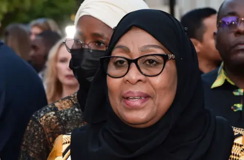 Getty Images President of Tanzania Samia Suluhu Hassan attends the Los Angeles premiere of "Tanzania: The Royal Tour" at Paramount Studios on April 21, 2022 in Los Angeles, California