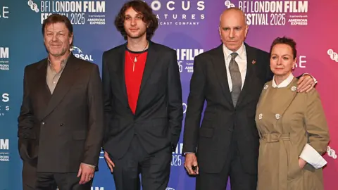 Getty Images Sean Bean, Ronan Day-Lewis, Daniel Day-Lewis and Samantha Morton pose at a red carpet ceremony for Anemone at the 69th BFI London Film Festival in October 2025