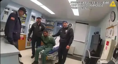 New York State Attorney General's Office Police body cam footage shows Brooks sitting on an examination bed