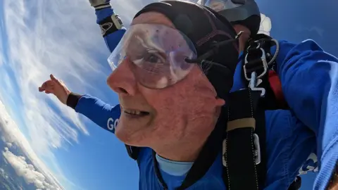GoSkydive Veteran James Mckellar, 88, in the sky during his skydive