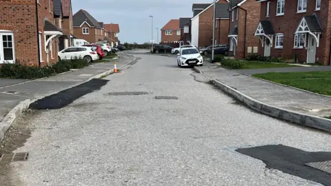 An unfinished road on a housing estate