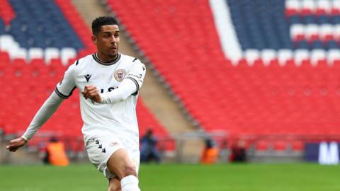 Louis Dennis featured in May's National League promotion final at Wembley