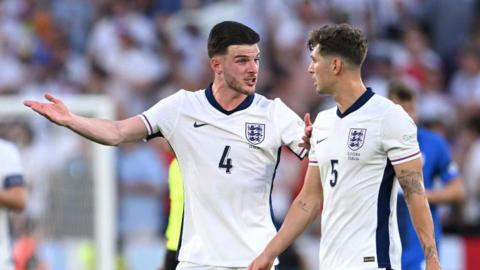 Declan Rice and John Stones in conversation during England's 0-0 draw with Slovenia