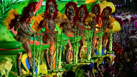 Getty Images Revellers of the Academicos do Salgueiro samba school perform atop a float during the closing night of the Rio Carnival at the Marques de Sapucai Sambadrome