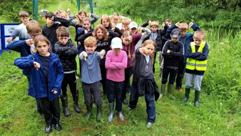 A group of primary school children close to the river