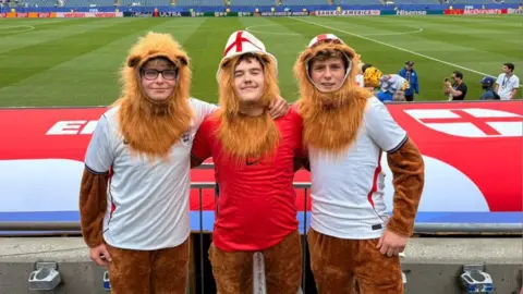 Supplied Ernie, Alfie and Charlie dressed as three lions