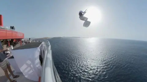 Kitesurfer Tom Bridge leaps from cruise ship