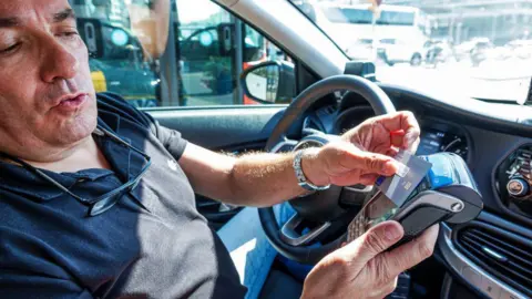 Card machine use in a taxi