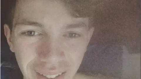 West Yorkshire Police Close-up image of Luke Thompson smiling.