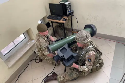 L/Cpl Oliver Wharton uses a javelin missile simulator to practise destroying a tank