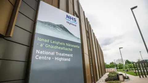 A sign saying National Treatment Centre - NHS Highland