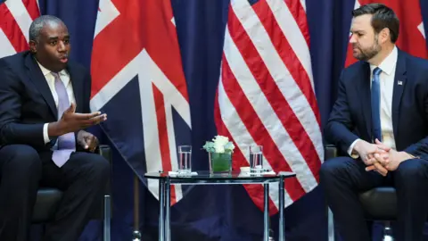 Reuters, British Foreign Secretary David Lamy speaks as he attends a bilateral meeting with US Vice President JD Vance 