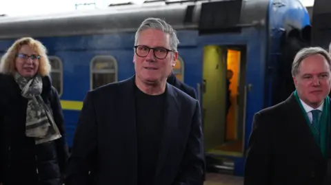 PA Sir Keir Starmer steps off the train at Kyiv railway station