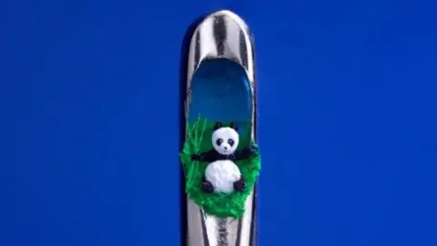 David A Lindon A panda sculpture in the eye of a needle